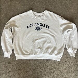 Hollister White Crewneck with Navy Print. Never worn